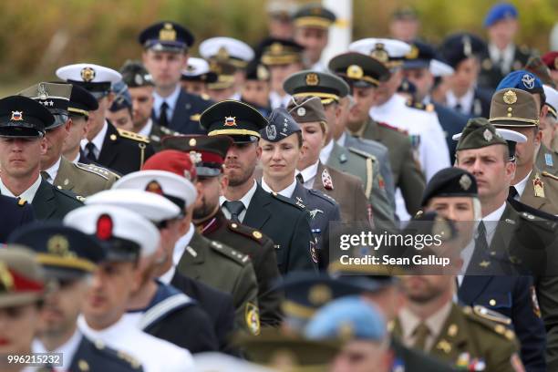 Men and women soldiers from different nations march in the opening ceremony at the 2018 NATO Summit at NATO headquarters on July 11, 2018 in...