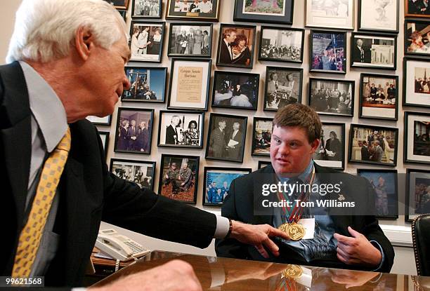 Sen. Thad Cochran, R-Miss., inspects Gold Medals won by Special Olympian Ben Mangum of Oxford, Miss., during a meeting to discuss the importance of...
