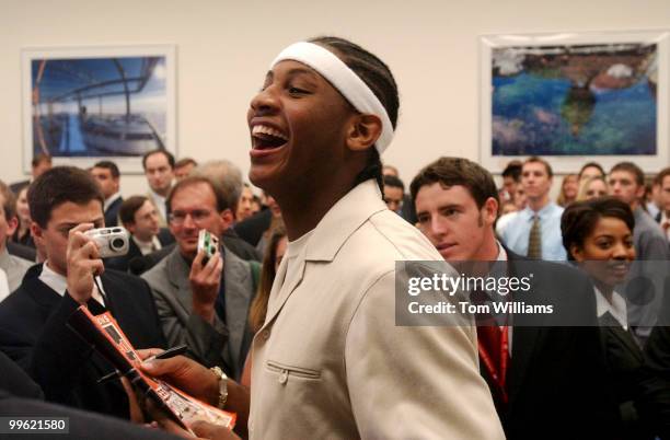 Carmelo Anthony of the 2003 National Champion Syracuse Orangemen, laughs at a friends remark during a reception in for th team hosted by Rep. Jim...