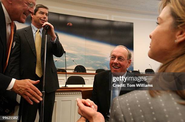 Jim Boeheim, right center, coach of the 2003 National Champion Syracuse Orangemen, and his wife Julie, laugh with Reps. Sherwood Boehlert, R-N.Y.,...