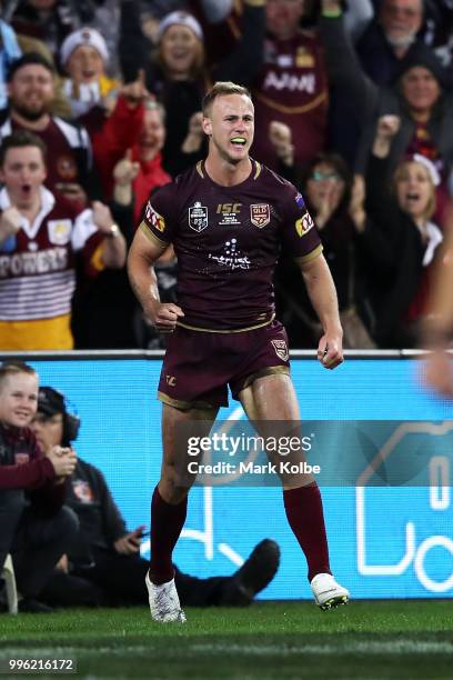 Daly Cherry-Evans of Queensland celebrates scoring a try during game three of the State of Origin series between the Queensland Maroons and the New...