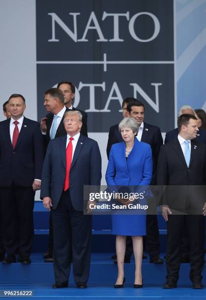 President Donald Trump and British Prime Minister Theresa May attend the opening ceremony at the 2018 NATO Summit at NATO headquarters on July 11,...