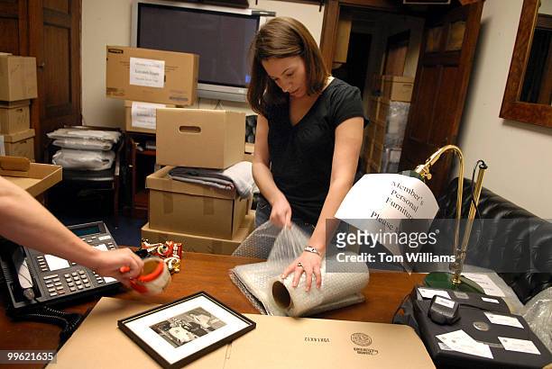 In the office of Rep. Phil English, R-Pa., Kelly Lavin, LA, packs for the office's move from Longworth to Rayburn.
