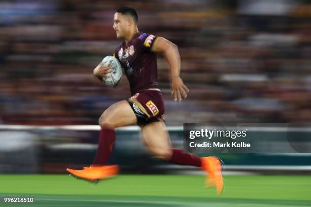 Valentine Holmes of Queensland runs the ball during game three of the State of Origin series between the Queensland Maroons and the New South Wales...