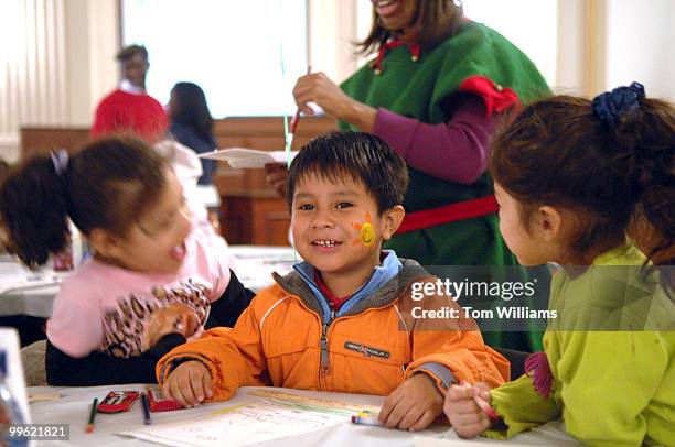 Miguel Lopez has his face painting admired by his schoolmates from Barbara Chambers Children's Center in Columbia Heights, during the annual "D.C....