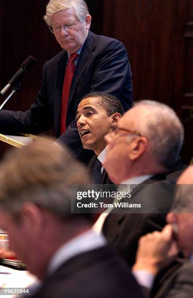 Sen. Barack Obama, D-Ill., speaks during a Lobbying Reform Summit, held at the National Press Club, alongside James Thurber, standing, director,...