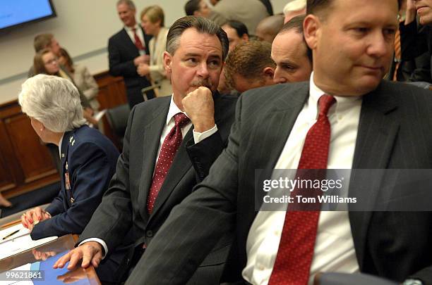 David Paulison, center, FEMA Administrator, and Matt Jadacki, Deputy Inspector General, Department of Homeland Security, confer with staff before a...