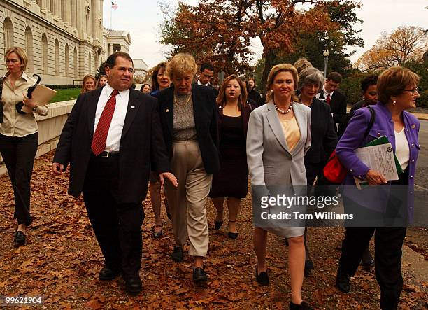 Front row, from left Reps. Jerry Nadler, D-N.Y., Zoe Lofgren, D-Calif., Carolyn Malony, D-N.Y., and Louise Slaughter, D-N.Y., left, make their way...