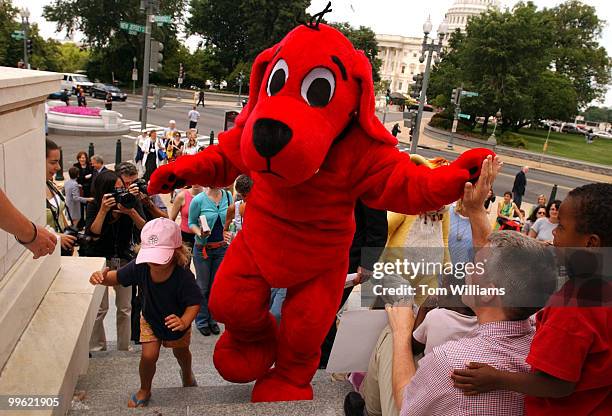 Clifford the Big Red Dog, makes his way up the Cannon steps en route to a rally to protect the public radio and television from $100 million of...