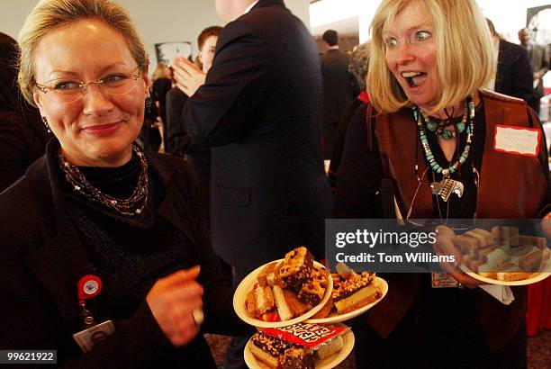 Staffers for Sen. Robert Byrd, D-W.V., Brenda Teutsch, left, and Martha Anne McIntosh, collect peanut butter snacks for the Senator at Peanut Butter...