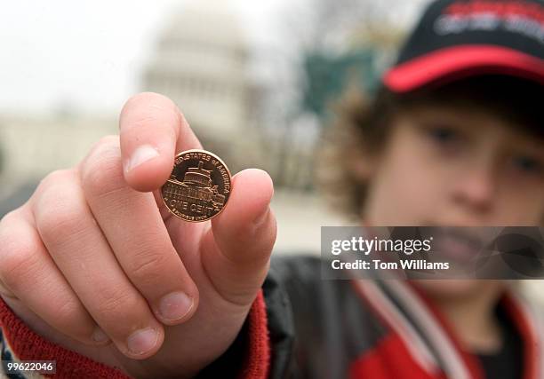 Elijah Wireman of Ohio, shows off his new one-cent coin, the 4th released by the U.S. Mint for the the Lincoln Bicentennial, after a ceremony near...