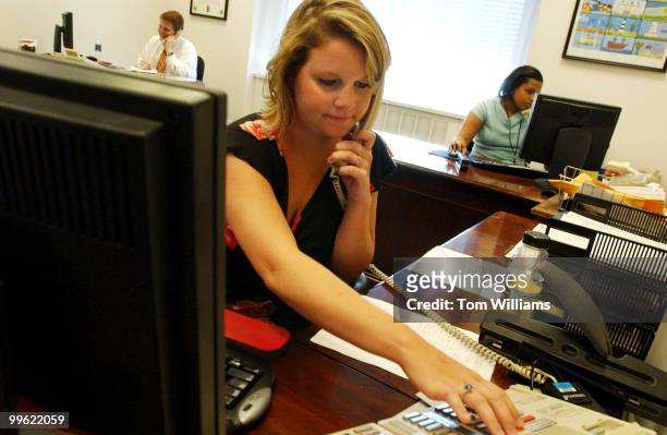 Staff assistant Tracy Allen, works the phones in the office of Sen. John Edwards, D-N.C., on the day it was announced Edwards will be the vice...