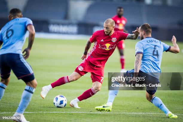 Daniel Royer of New York Red Bulls looks for the opening against Maxime Chanot of New York City and Alexander Callens of New York City during the...