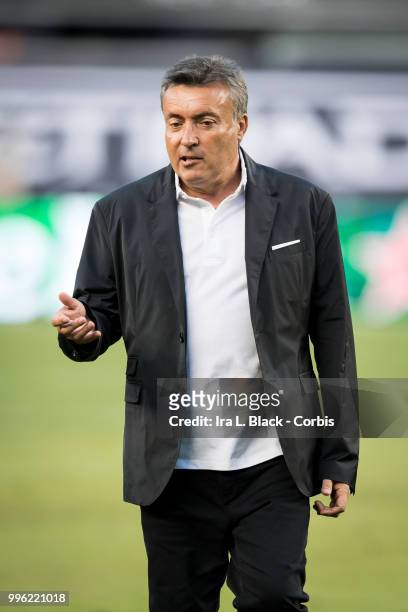 Head Coach Domenec Torrent of New York City talks with a member of his coaching staff during the Major League Soccer Hudson River Derby match between...