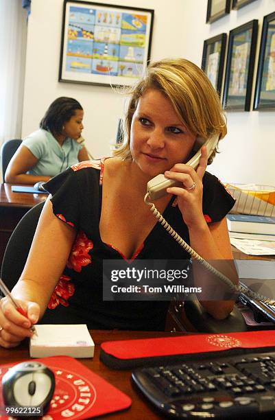 Staff assistant Tracy Allen, works the phones in the office of Sen. John Edwards, D-N.C., on the day it was announced Edwards will be the vice...