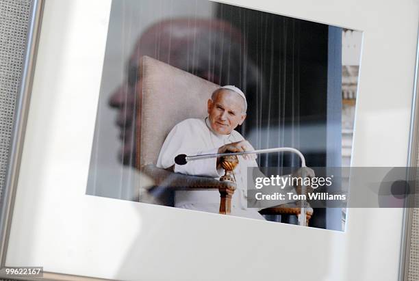 Sen. Pat Leahy, D-Vt., talks about a picture he took of Pope John Paul II on display as part of an exhibit showcasing his photos from over three...