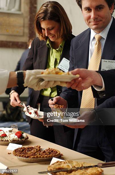 Michelle Wizov and Fred Shumate, from the office Rep. Charles Boustany, R-La., serve themselves pie at the NATSO Pie Reception in Rayburn, Tuesday....