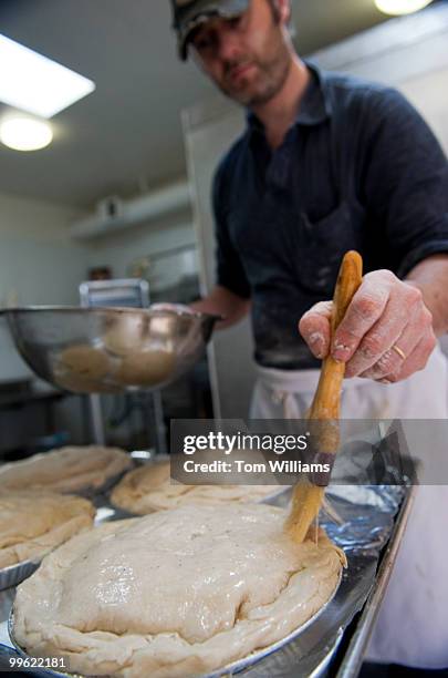 Stevie McKeever, makes a Steak Mushroom Onion and Gruyere pie in the kitchen of Dangerous Pies on H Street, NE, April 5, 2010.