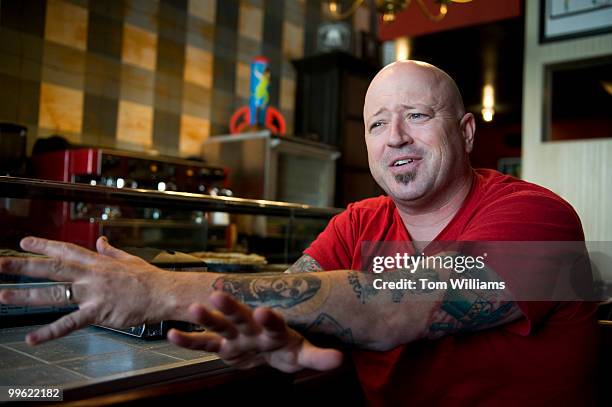 Rodney Henry, co-owner of Dangerous Pies on H Street, NE, is interviewed at the counter, April 5, 2010.