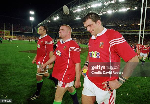 Danny Grewcock, Phil Vickery and Martin Johnson of the British and Irish Lions are dejected after the third and final Test Match played between the...