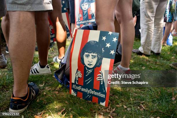 View of a sign at the foot of a demonstrator during a rally against the Trump administration's immigration policies, Washington DC, June 27, 2018. It...