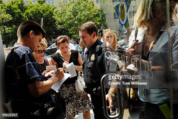 Fraternal Order of Police Chairman Andy Maybo, center, talks with reporters after a news conference in which members of the Capitol Police and...