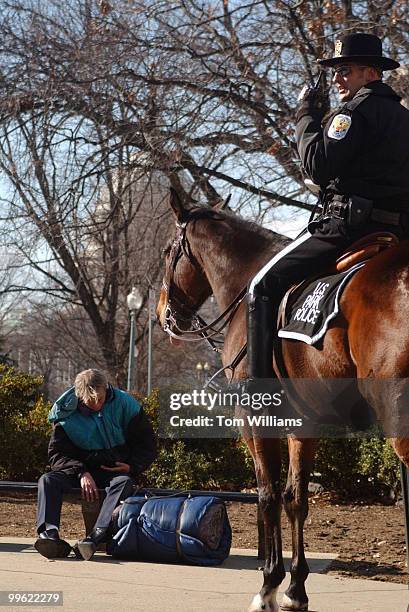 Park Police Officer issues a warning to a Dudley Wayne Culpepper a warning for sleeping on a park bench on Constitution Ave.