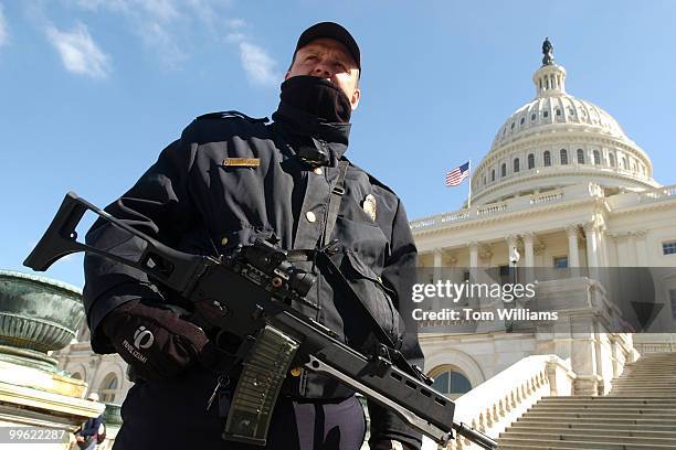 Capitol Police Officer PFC Steve Karlinchak, stands guard on the West Front of the Capitol, armed with an HK G36.