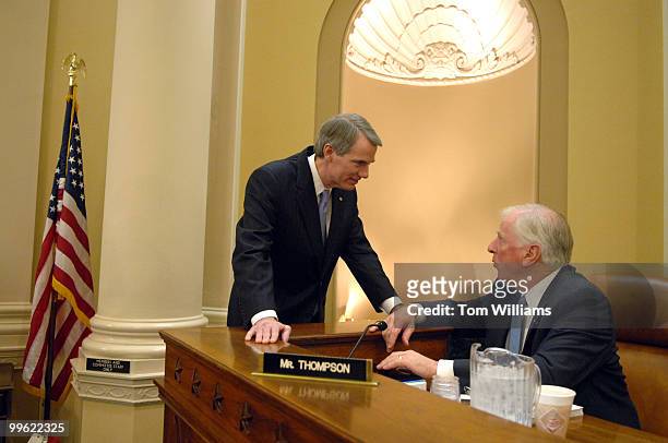 Director Rob Portman, left, talks with Rep. Mike Thompson, D-Calif., during a break in a House Ways and Means Committee hearing on the FY2008 budget.