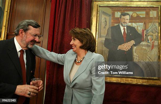 House Minority Leader Nancy Pelosi, D-Calif., hugs Rep. David Obey, D-Wis., after his portrait was unveiled in the House Committee on Appropriations...