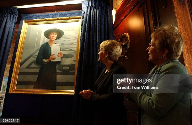 Reps. Nancy Johnson, R-Conn., right, and Marcy Kaptur, D-Ohio, admire the portrait of Jeannette Rankin of Monatana, who was the first woman elected...
