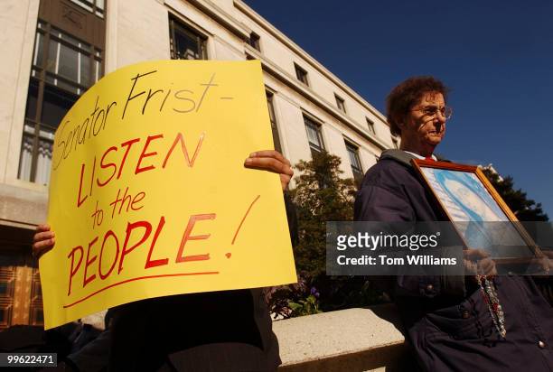 Florence Pasco, holds a picture of the Madonna, at a protest by relgious groups opposing the nomination of Sen. Arlen Specter, R-Pa., for the...