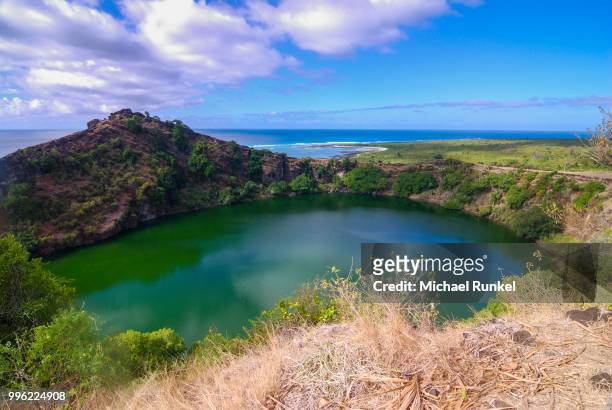 lagoon in a volcanic crater, grande comore, comoros - see crater lake stock-fotos und bilder