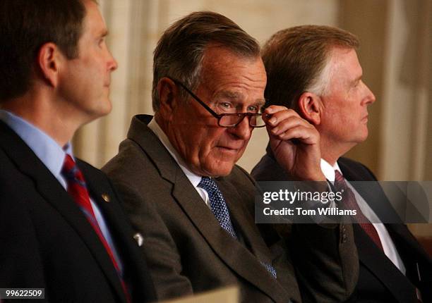 Former President George Bush attends an unveiling ceremony for the bust of Former Vice President Dan Quayle in the Rotunda, Tuesday. Sen. Bill Frist,...