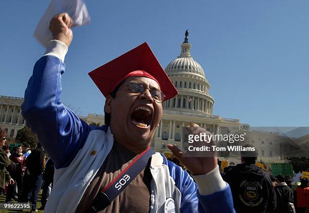 Angelo of Mexico, chants pro immigration rhetoric at a rally for fair immigration reform on the West Front of the Capitol. He wears a graduate cap to...