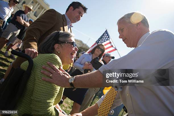 Chairman of the House Republican Conference Mike Pence, R-Ind., greets Maryann Sluhan of Toledo, during an anti health care reform rally on the west...