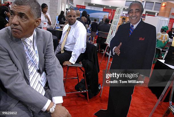 Ralph Metcalfe, left, and author William C. Rhoden wait for the arrival of Rep. Charlie Rangel, D-N.Y., at the 37th Annual Legislative Conference...