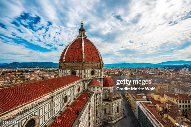 florence cathedral, cattedrale di santa maria del fiore with the dome by brunelleschi, city at the back, unesco world heritage site, florence, tuscany, italy - fiore stock pictures, royalty-free photos & images