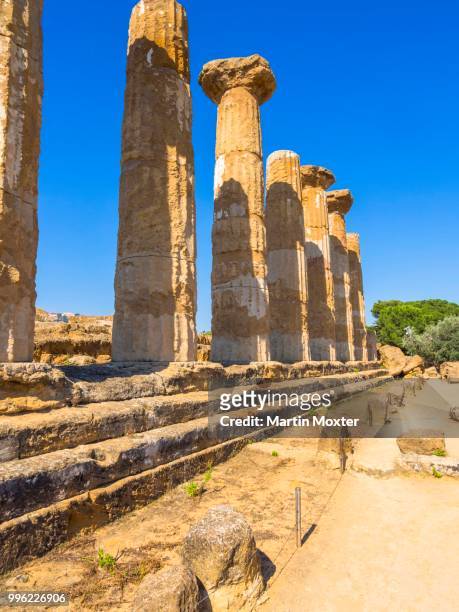 tempio di ercole, temple of heracles or hercules, valley of the temples, archaeological site of agrigento, unesco world heritage site, sicily, italy - tempio stock pictures, royalty-free photos & images