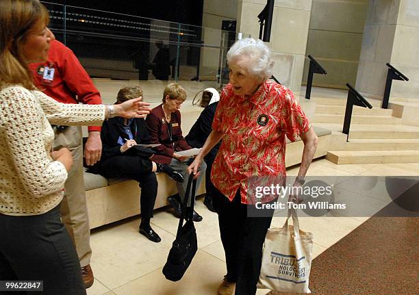 Hilda Seftor of Annandale, is greeted by Wendy Rudolph a volunteer for the U.S. Holocaust Memorial Museum after Seftor read names of Holocaust...