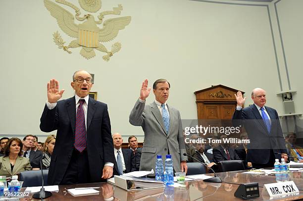 From left, Alan Greenspan, former chairman of the Federal Reserve, Christopher Cox, SEC Chairman, and John Snow former Treasury Secretary are sworn...