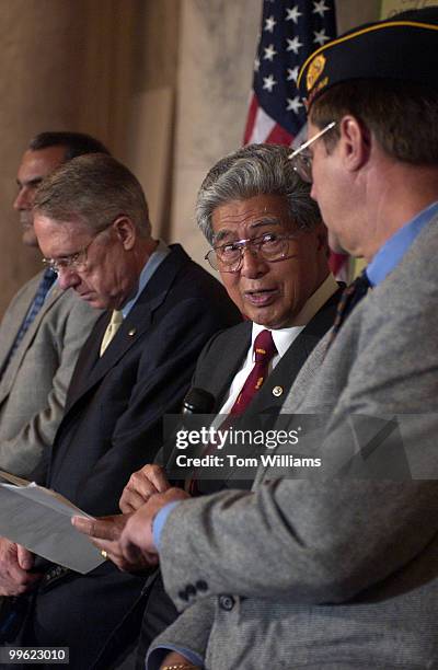 Sen. Daniel Akaka, D-Hawaii, speaks to Steve Robertson of the American Legion, during a news conference to call on the Senate to support veteran's...