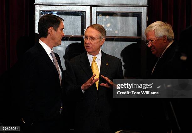 From left, Senate Majority Leader Bill Frist, R-Tenn., Senate Minority Leader Harry Reid, D-Nev., and Speaker Dennis Hastert, R-Ill., confer in the...