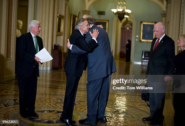 Senate Majority Leader Harry Reid, D-Nev., left, hugs Sen. John Rockefeller, D-W.V., after the Senate voted to begin debate on health care...
