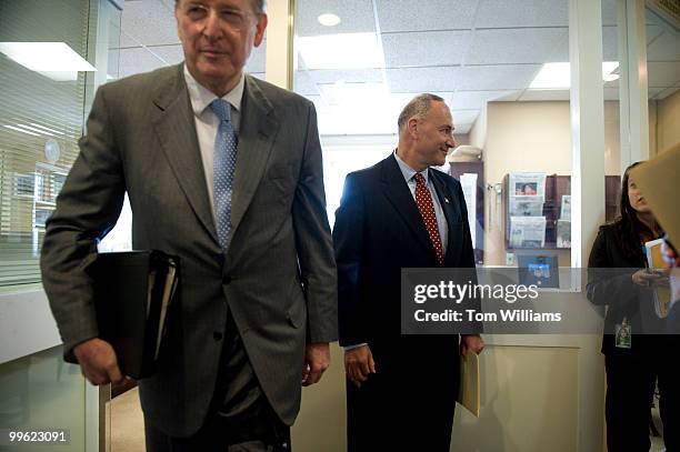 Sens. John Rockefeller, D-W.V., left, and Charles Schumer, D-N.Y., make their way to a news conference on health care reform, July 15, 2009.