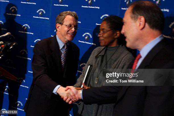 Sen. Mike DeWine, R-Ohio, speaks to Dr. Marsha Martin, Executive Director of AIDS Action, and Robert Liberatore, Senior Vice President,...