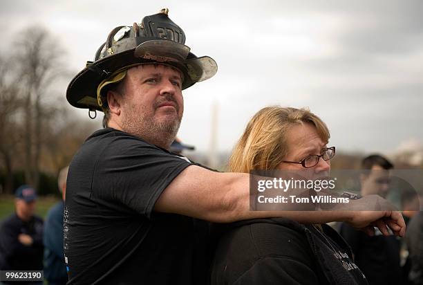 James Schneider, a NYC firefighter, and his wife Julia, attend a news conference to urge passage of the "James Zadroga 9/11 Health and Compensation...