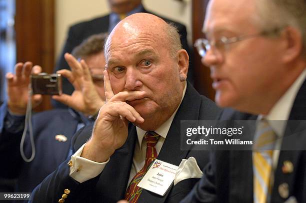 James Flanigan, center, listens to Bill Baker talk with a member of Sen. Robert Casey's staff, during a lobbying trip to the Hill by members of...