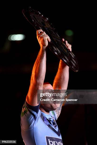 Boyd Cordner of the Blues celebrates with the trophy after winning the series following game three of the State of Origin series between the...