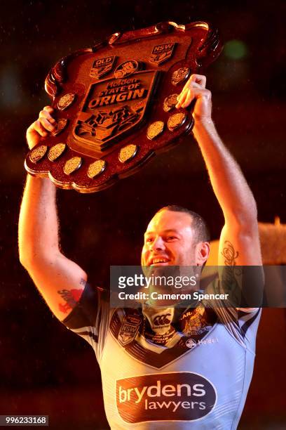 Boyd Cordner of the Blues celebrates with the trophy after winning the series following game three of the State of Origin series between the...